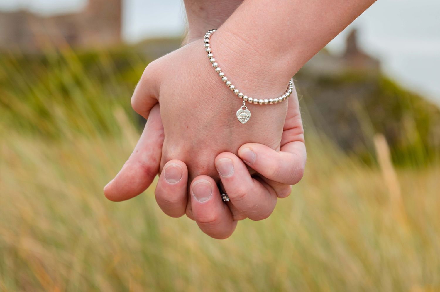Natural outdoor couple portraits in Northumberland coast North East England pre-wedding session engagement shoot