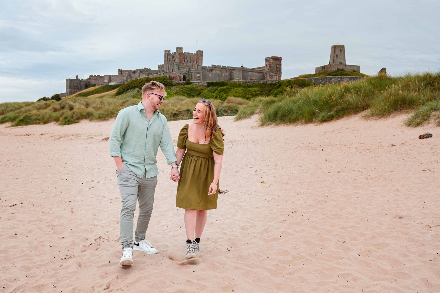 Natural outdoor couple portraits in Northumberland coast North East England pre-wedding session engagement shoot