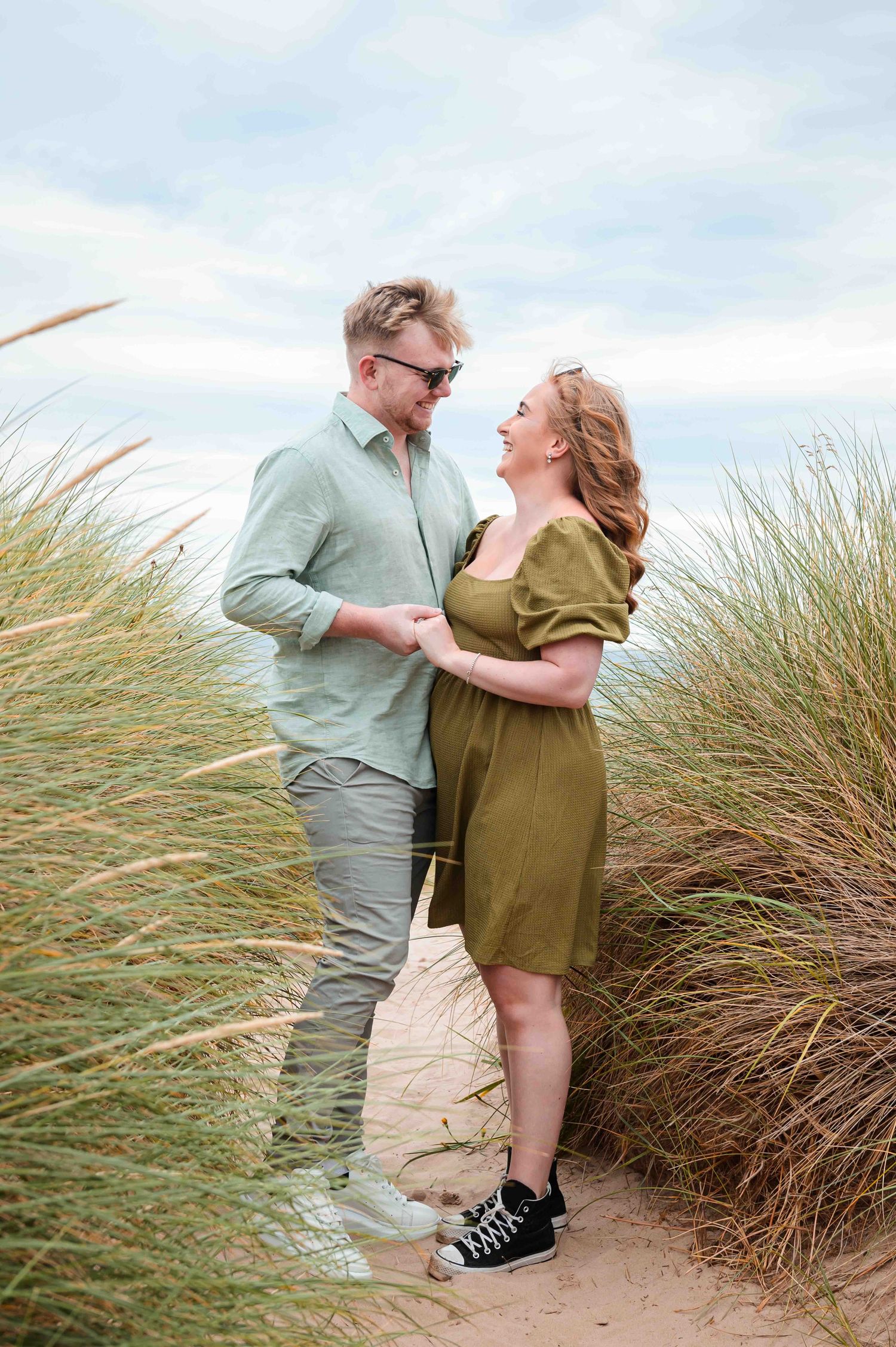 Natural outdoor couple portraits in Northumberland coast North East England pre-wedding session engagement shoot