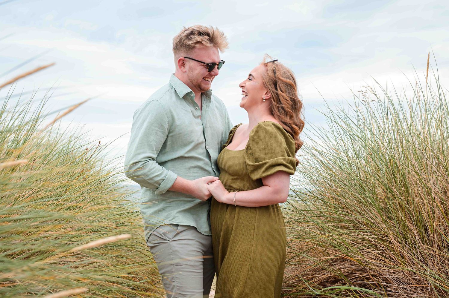 Natural outdoor couple portraits in Northumberland coast North East England pre-wedding session engagement shoot