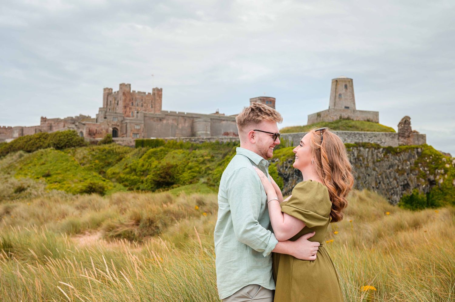Natural outdoor couple portraits in Northumberland coast North East England pre-wedding session engagement shoot