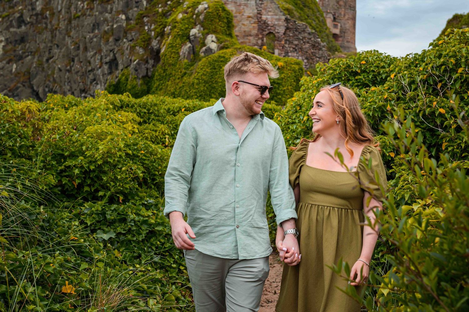 Natural outdoor couple portraits in Northumberland coast North East England pre-wedding session engagement shoot
