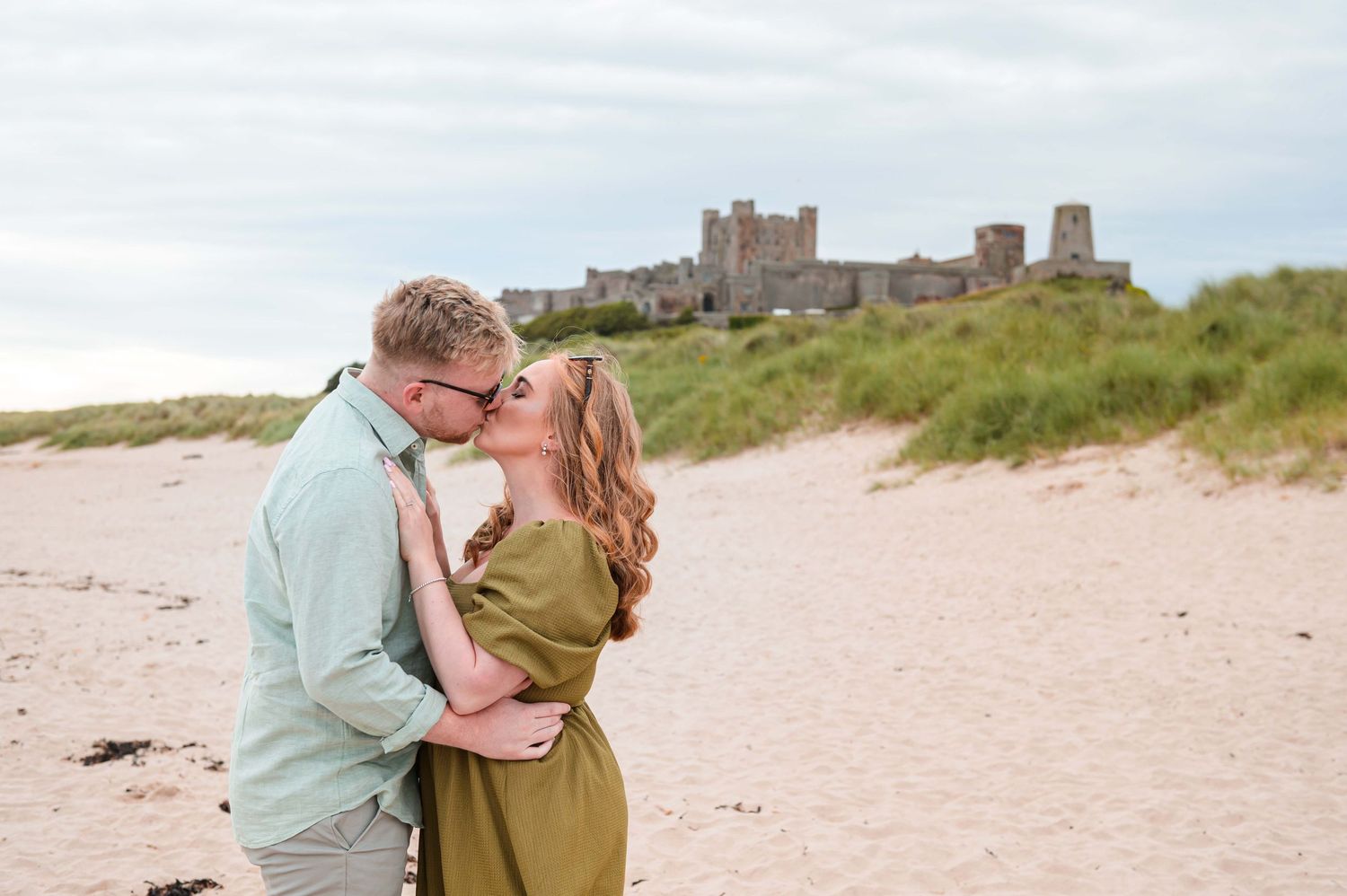 Natural outdoor couple portraits in Northumberland coast North East England pre-wedding session engagement shoot