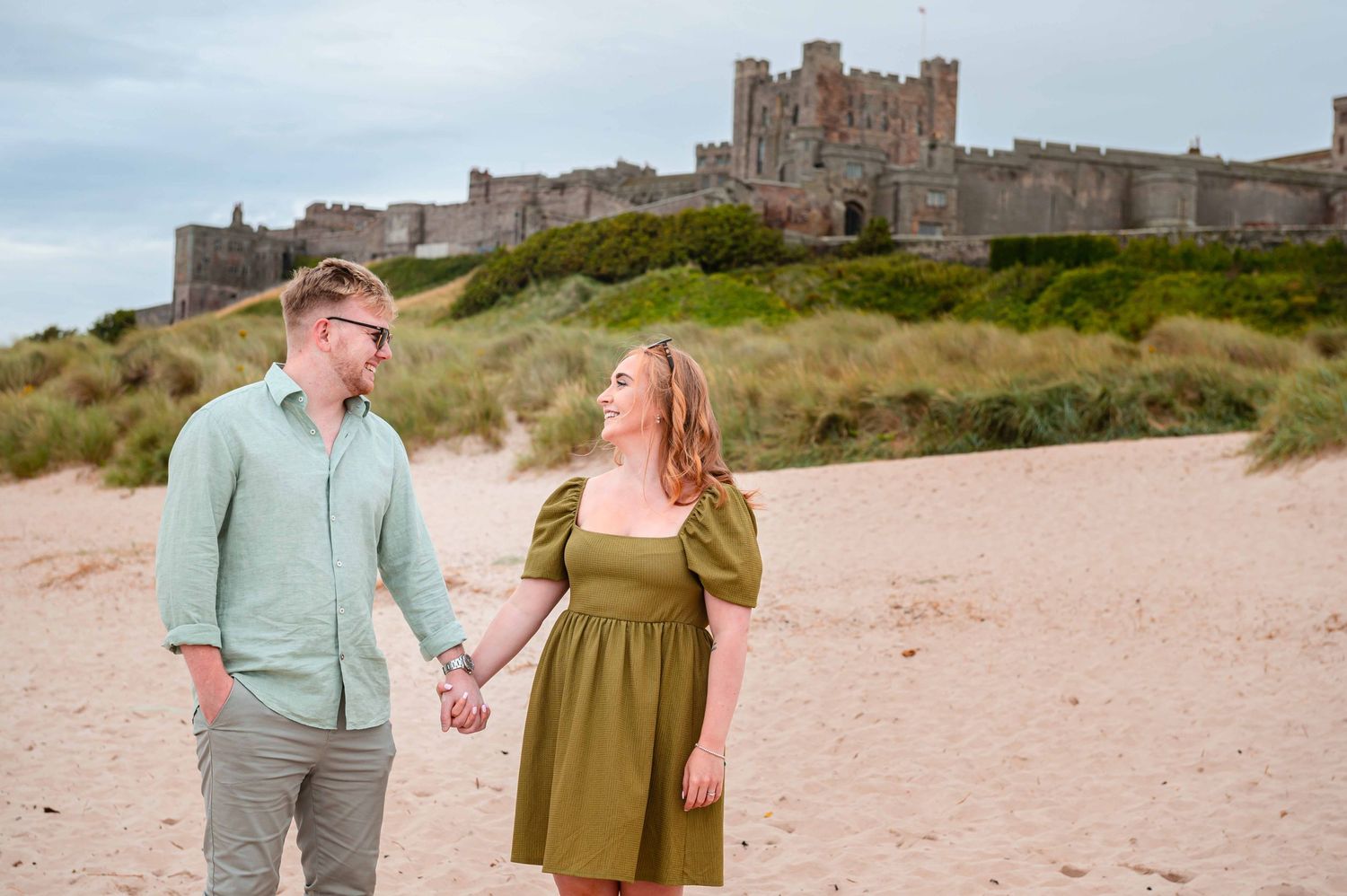 Natural outdoor couple portraits in Northumberland coast North East England pre-wedding session engagement shoot