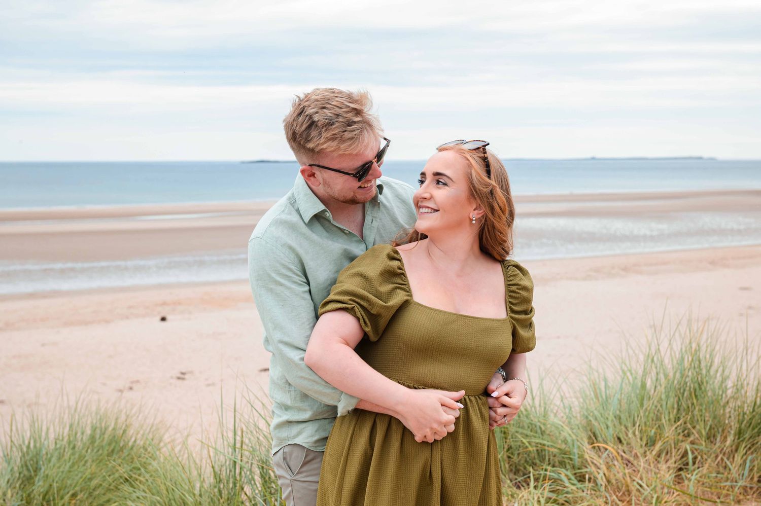 Natural outdoor couple portraits in Northumberland coast North East England pre-wedding session engagement shoot