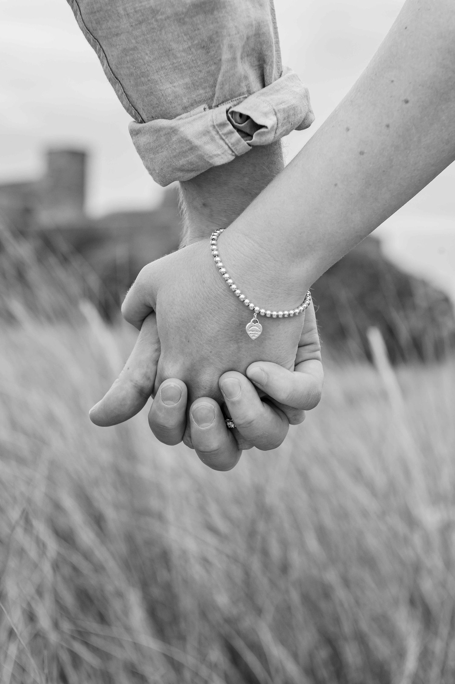Natural outdoor couple portraits in Northumberland coast North East England pre-wedding session engagement shoot
