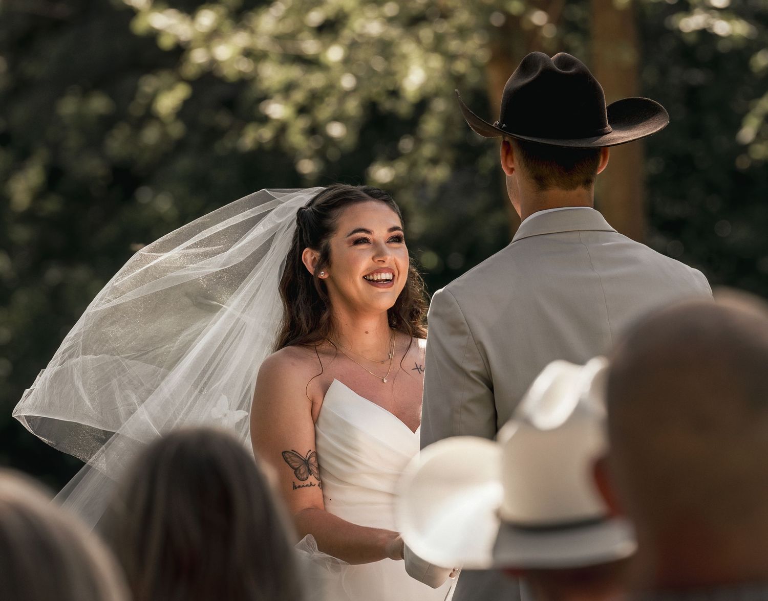 Bride smiling during intimate outdoor wedding ceremony at Roaring River State Park in Missouri