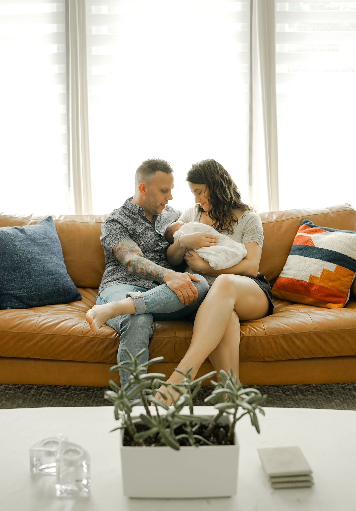 In-home newborn session with baby and parents in natural light Kansas City