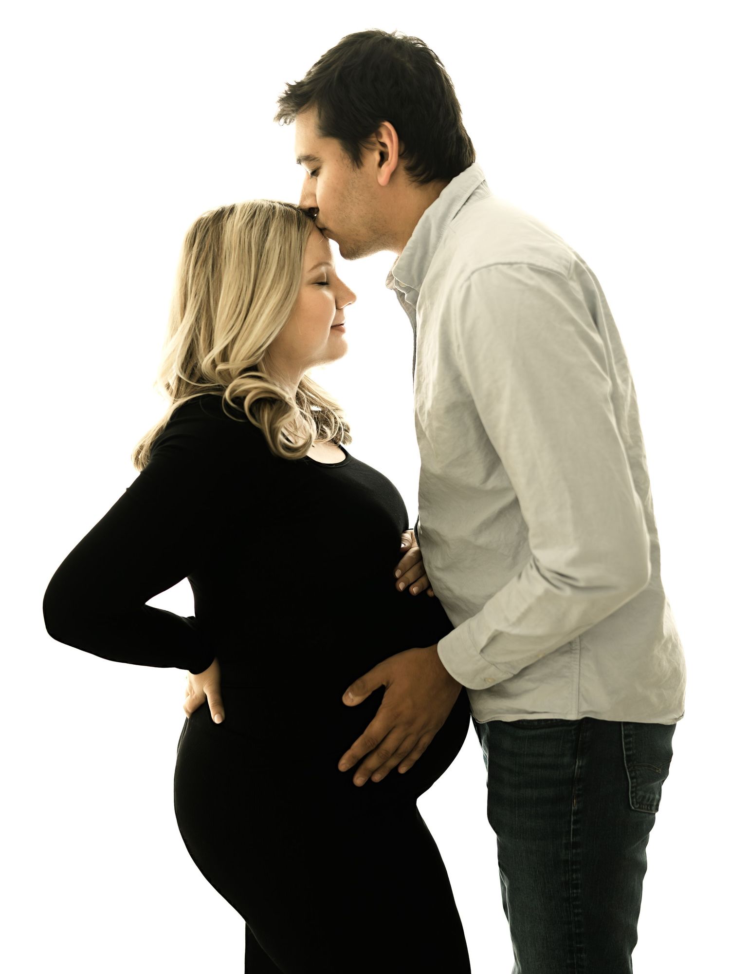 A sequence of black and white photos showing a couple embracing and interacting in a progressive dance-like motion.