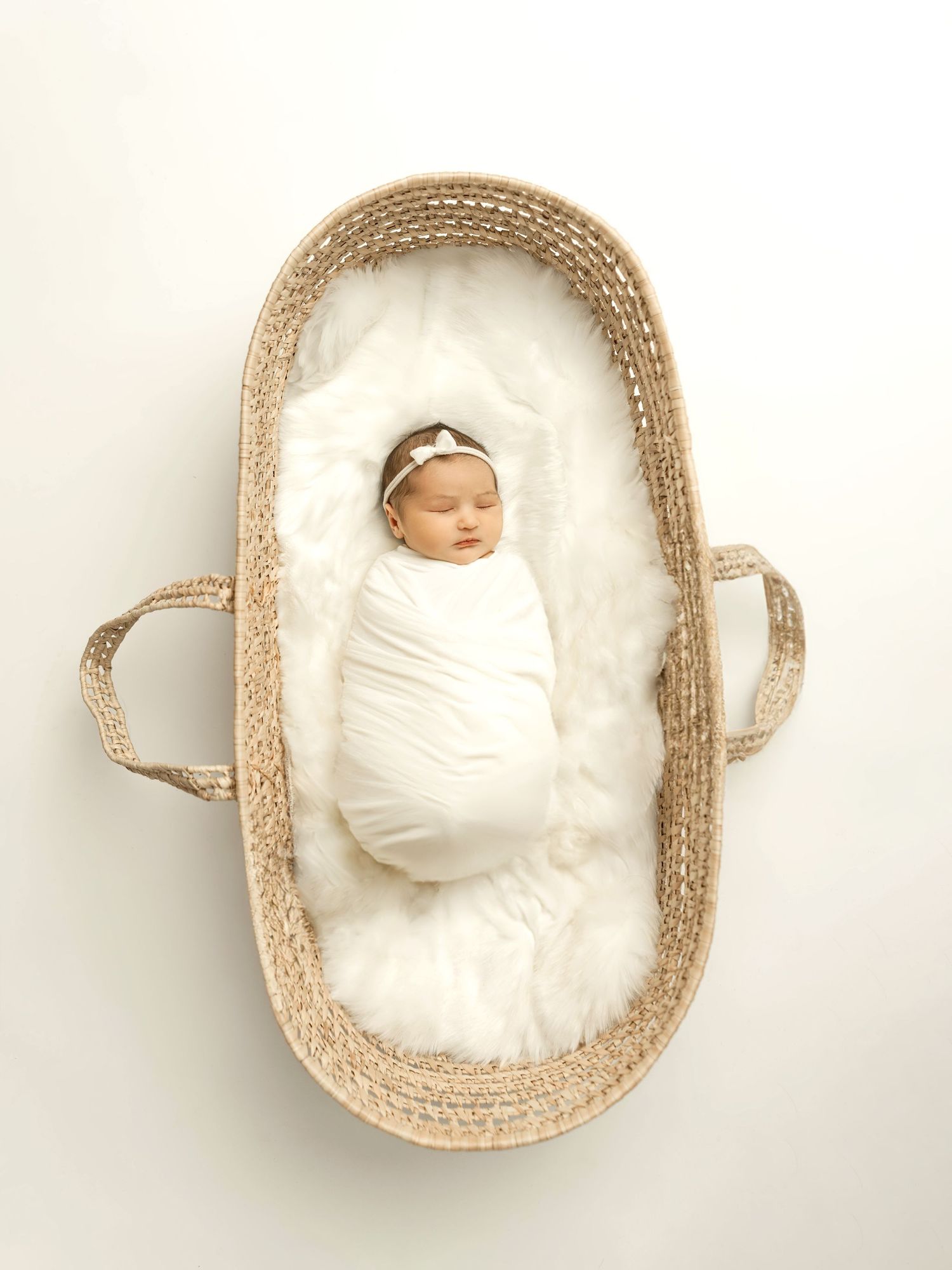 Newborn baby wrapped in soft neutral fabric, Kansas City newborn photographer