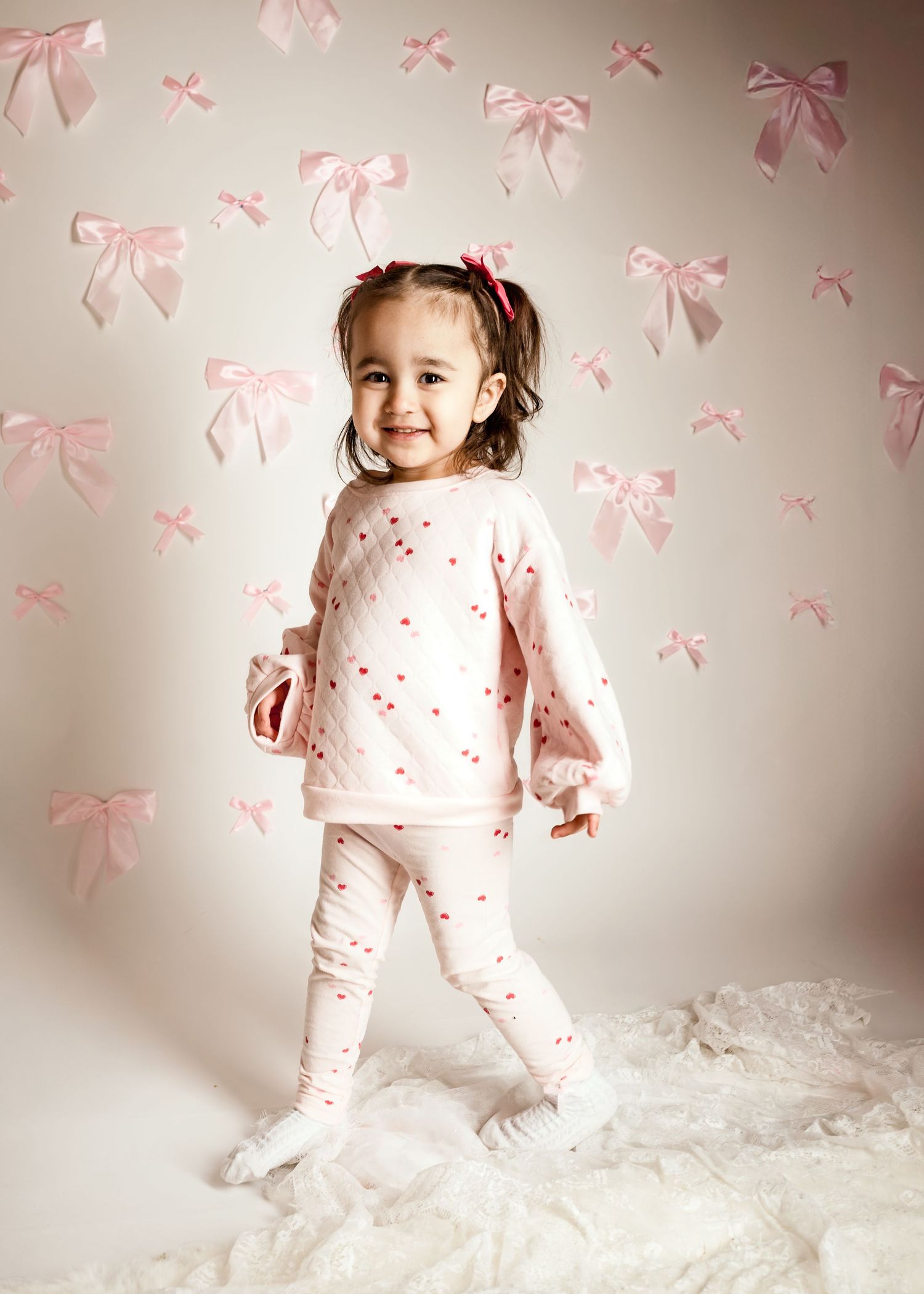 Smiling toddler during Bows and Blooms mini session in Blue Springs, Missouri studio | Kansas City children’s photography