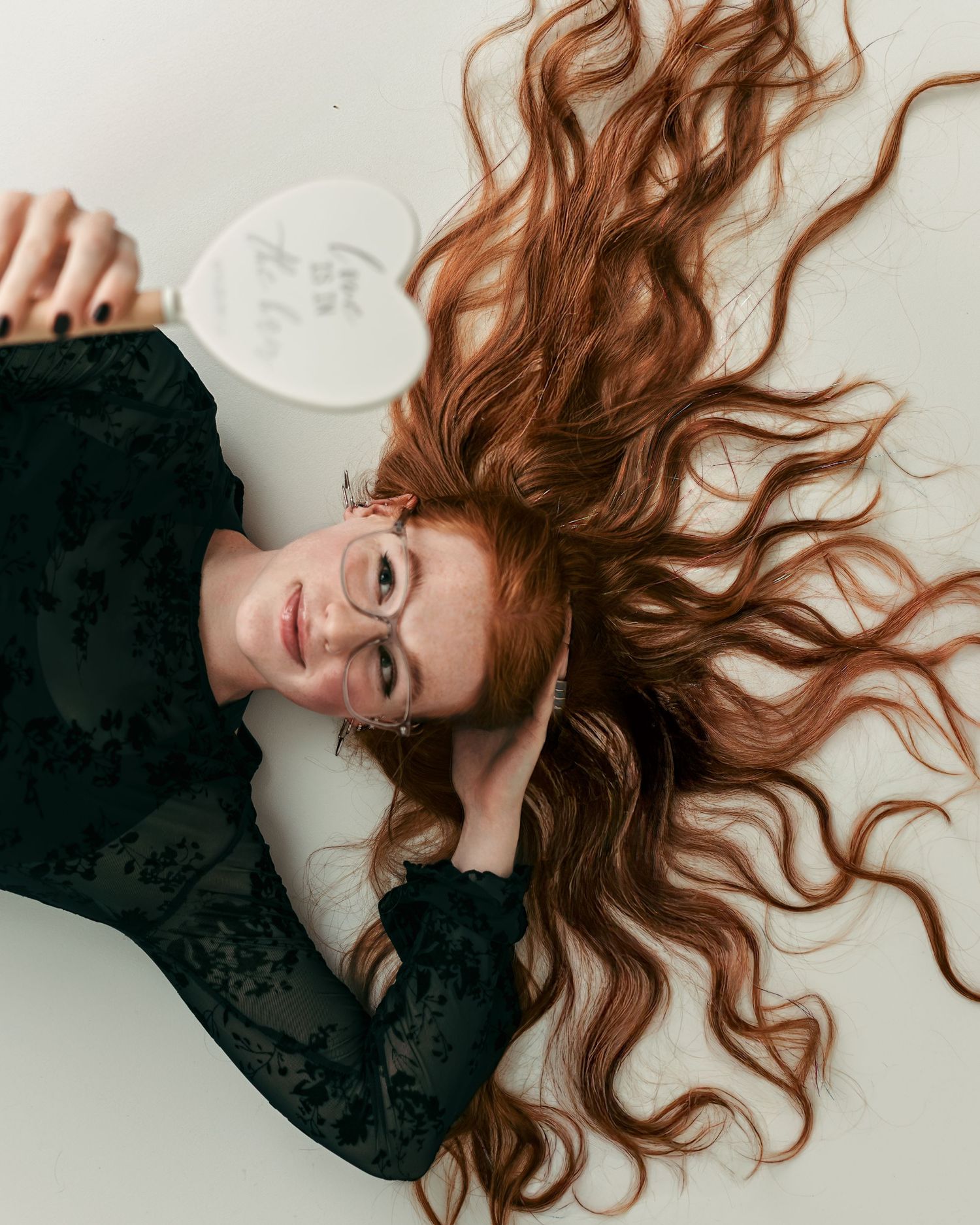 Kansas City bridal hairstylist with flowing red hair during a creative personal branding photography session.