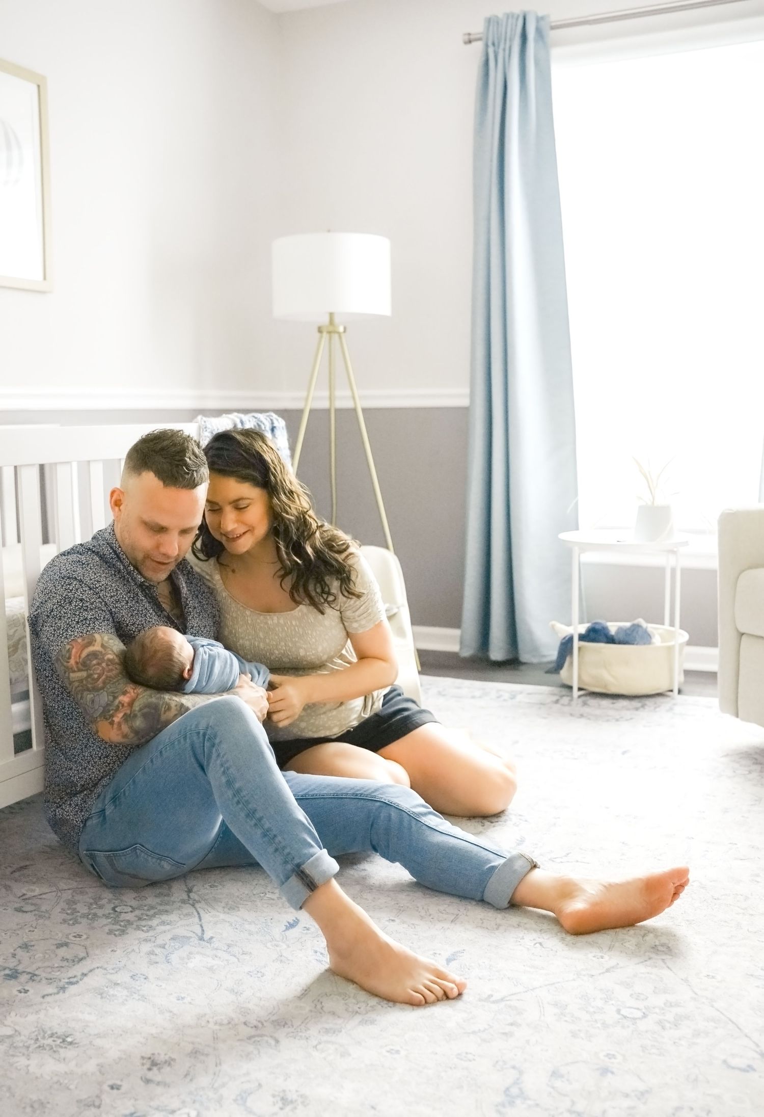 Family at home with newborn baby during lifestyle photography session