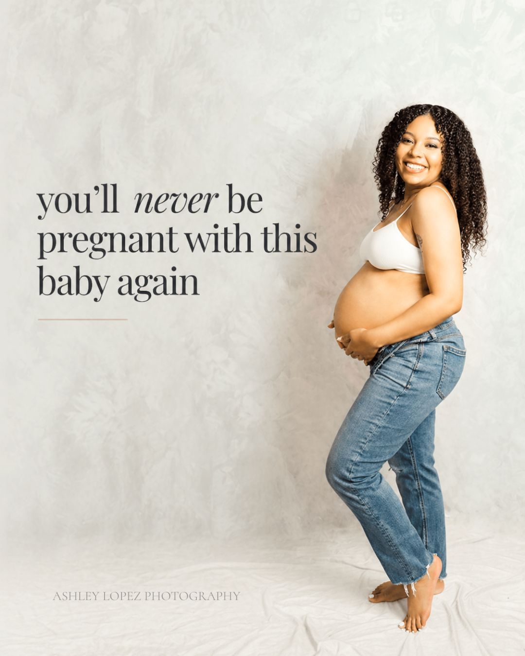 studio maternity photos Kansas City with mom in jeans and soft neutral backdrop