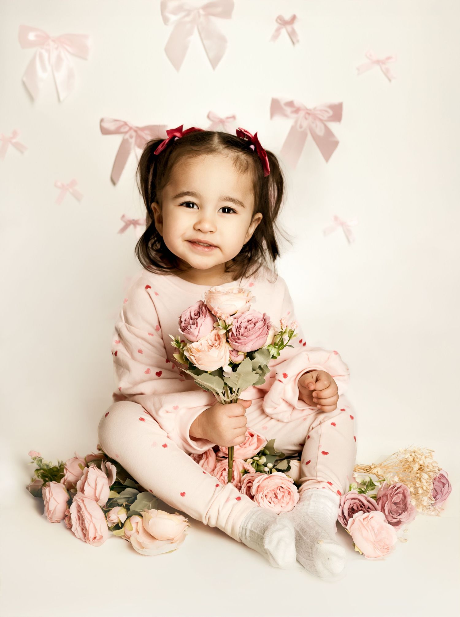 Timeless studio portrait of toddler girl with bows and soft pink tones | Kansas City children’s photographer Ashley Lopez Photography