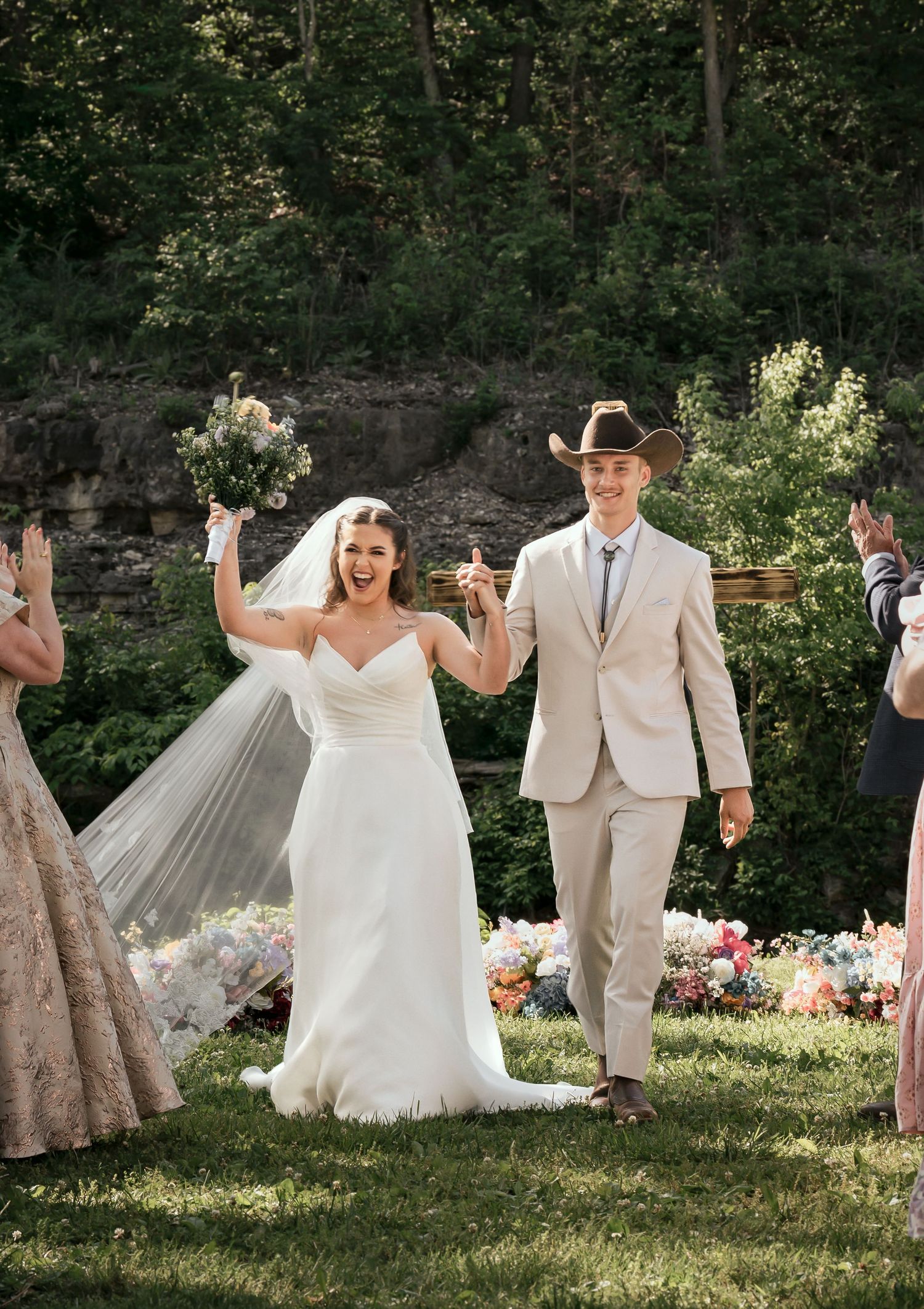 Bride and groom celebrating after wedding ceremony at Roaring River State Park in Missouri