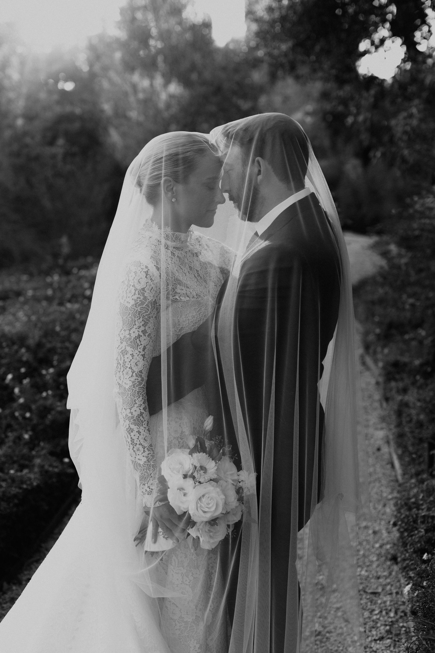 Black and white photo series showing delicate details of a bride's veil and wedding dress in natural light in Santa Barbara, CA.