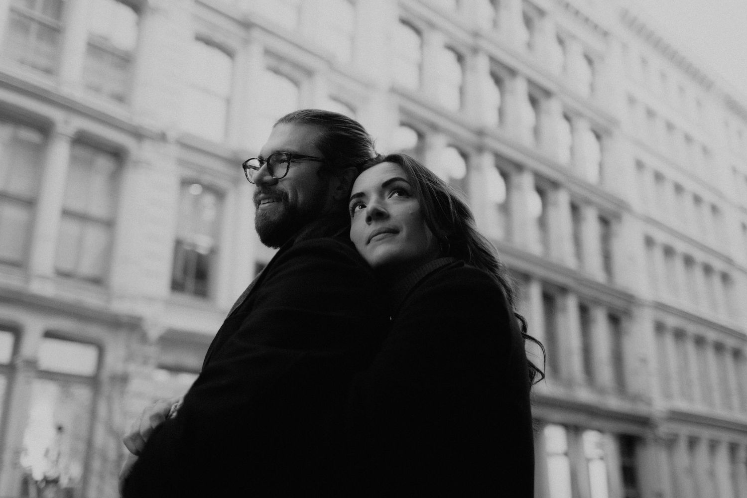 Romantic black and white photo shoot in front of historic New York City architecture.