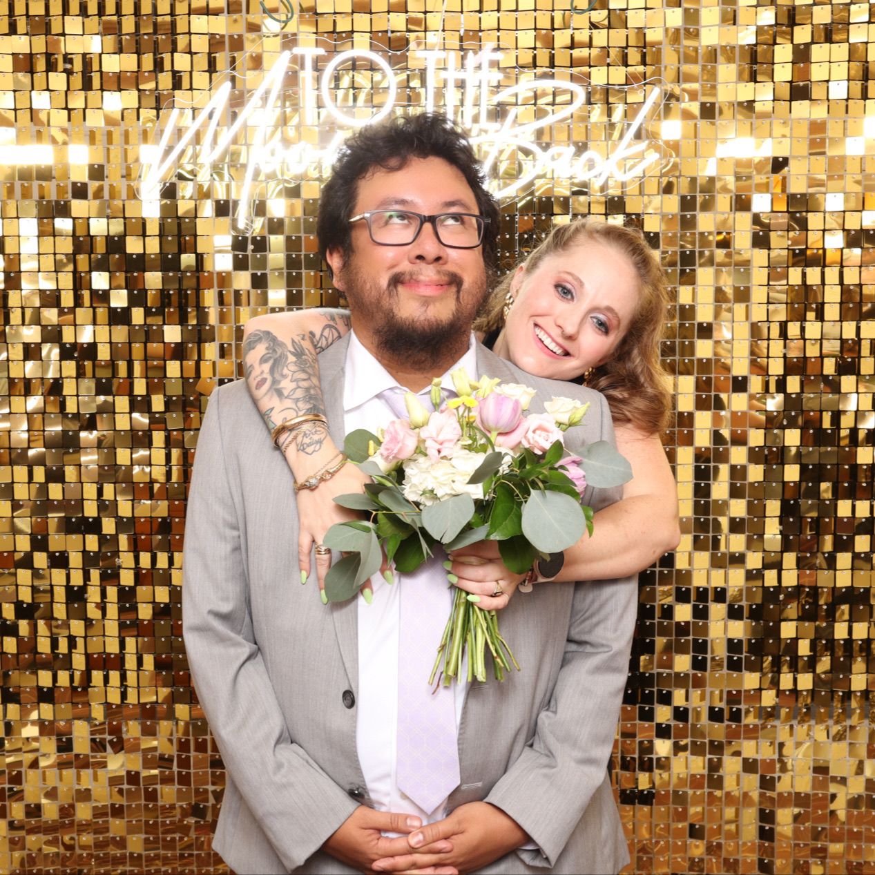 Couple in front of Gold Shimmer Wall Photo Booth at Maryland Wedding