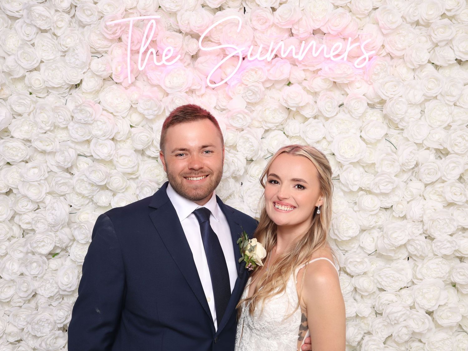 Bride and Groom with Flower Wall Photo Booth on Eastern Shore Maryland