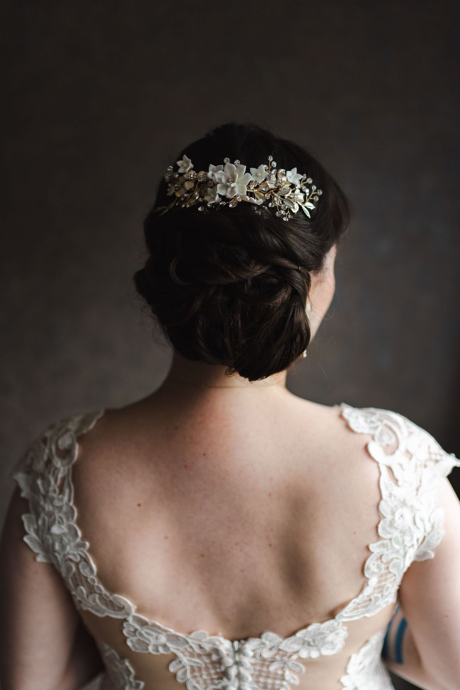 Westin Hotel in downtown Toronto Harbour Waterfront. A low back lace dress with an updo bridal hairstyle and floral hairpiece.