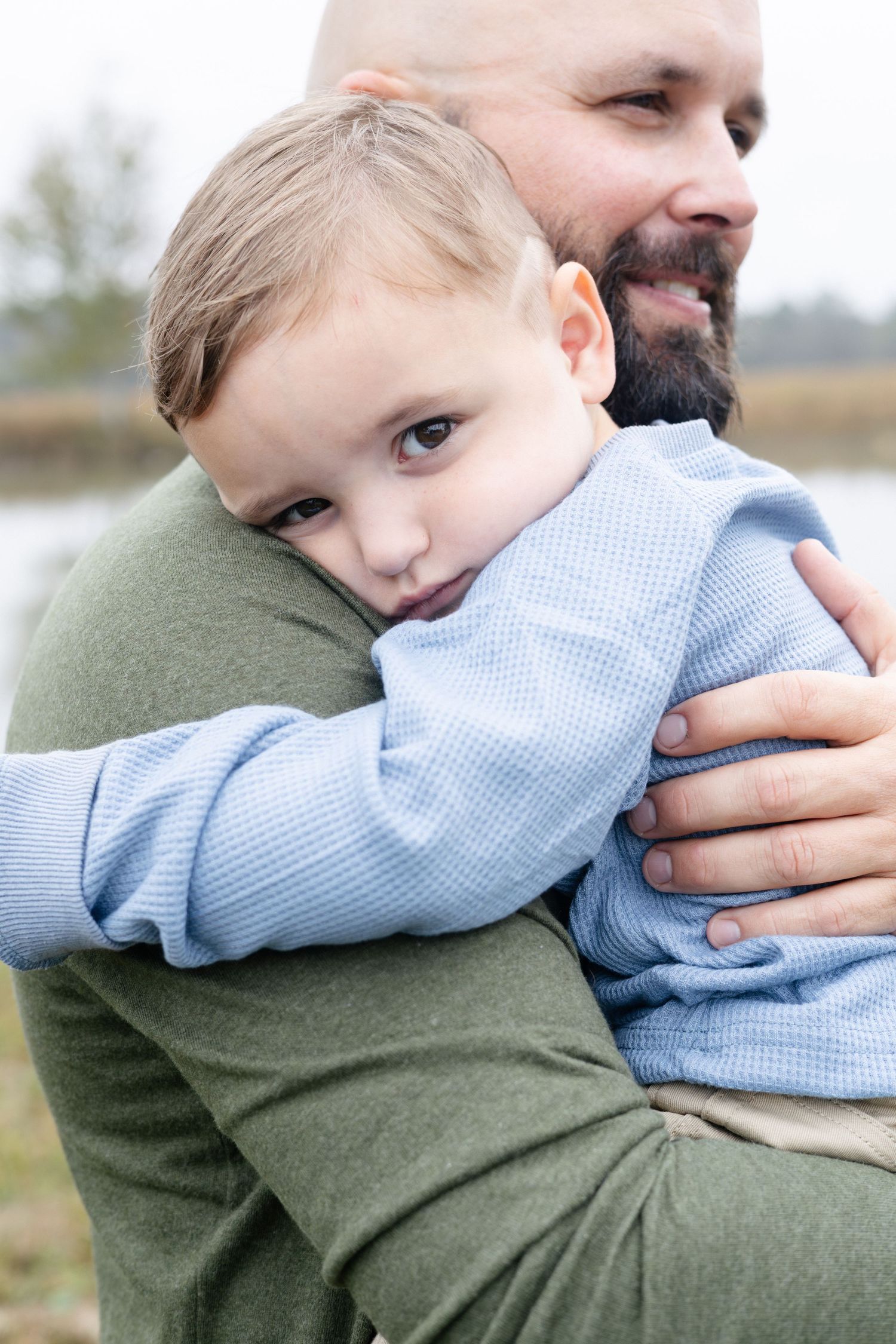 Portrait of a tosdler boy and his father embracing