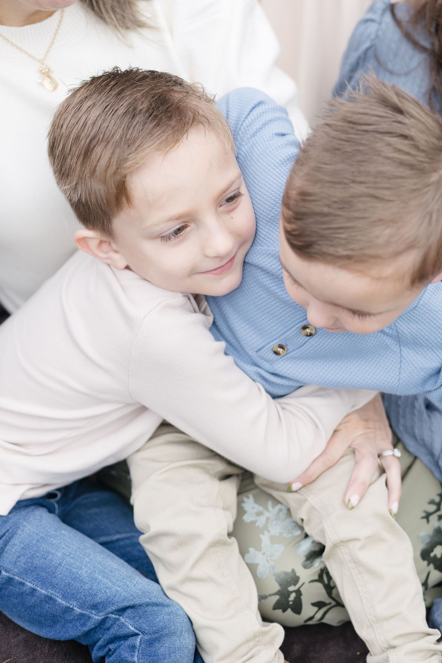 two young brothers embracing