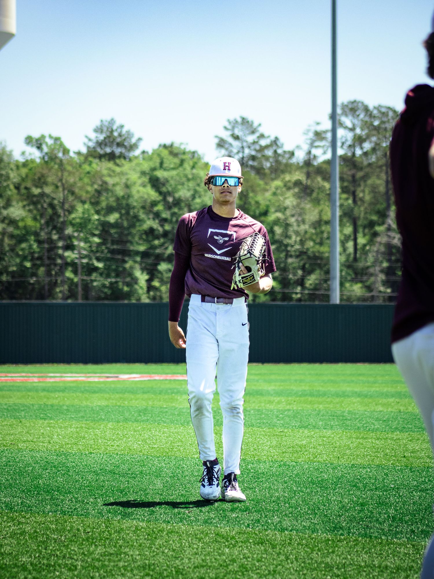 A photo made by shotz.by.jah of the athlete ceylan williams walking on the outfeild