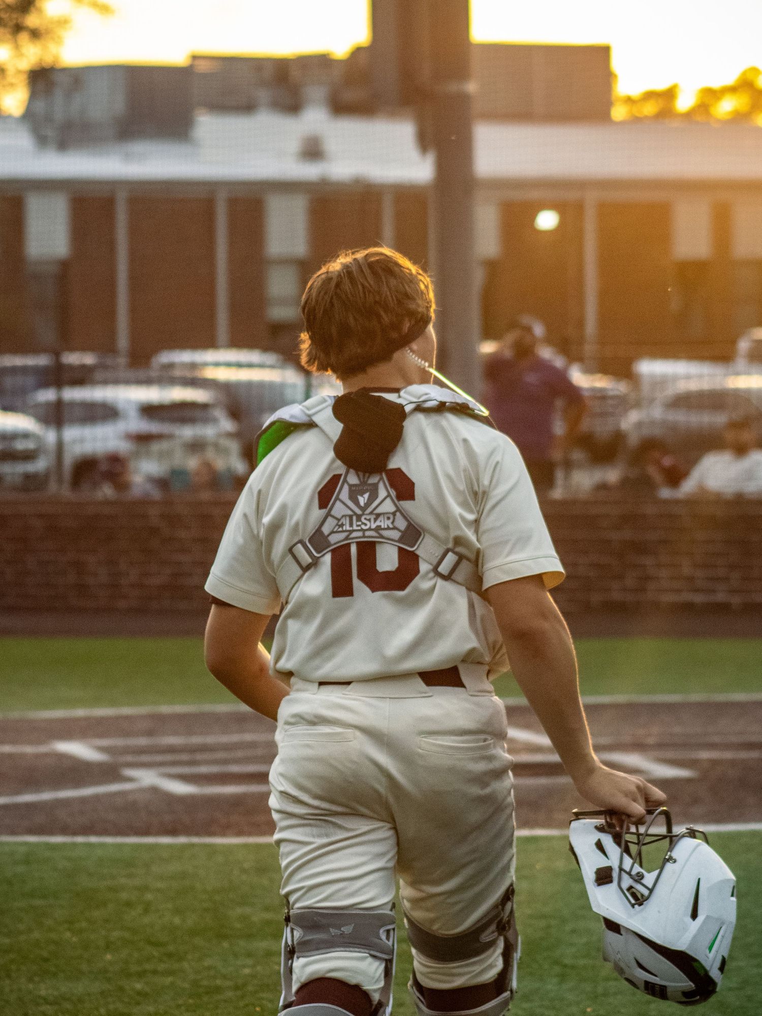 A photo made by shotz.by.jah of a catcher walking onto a feild