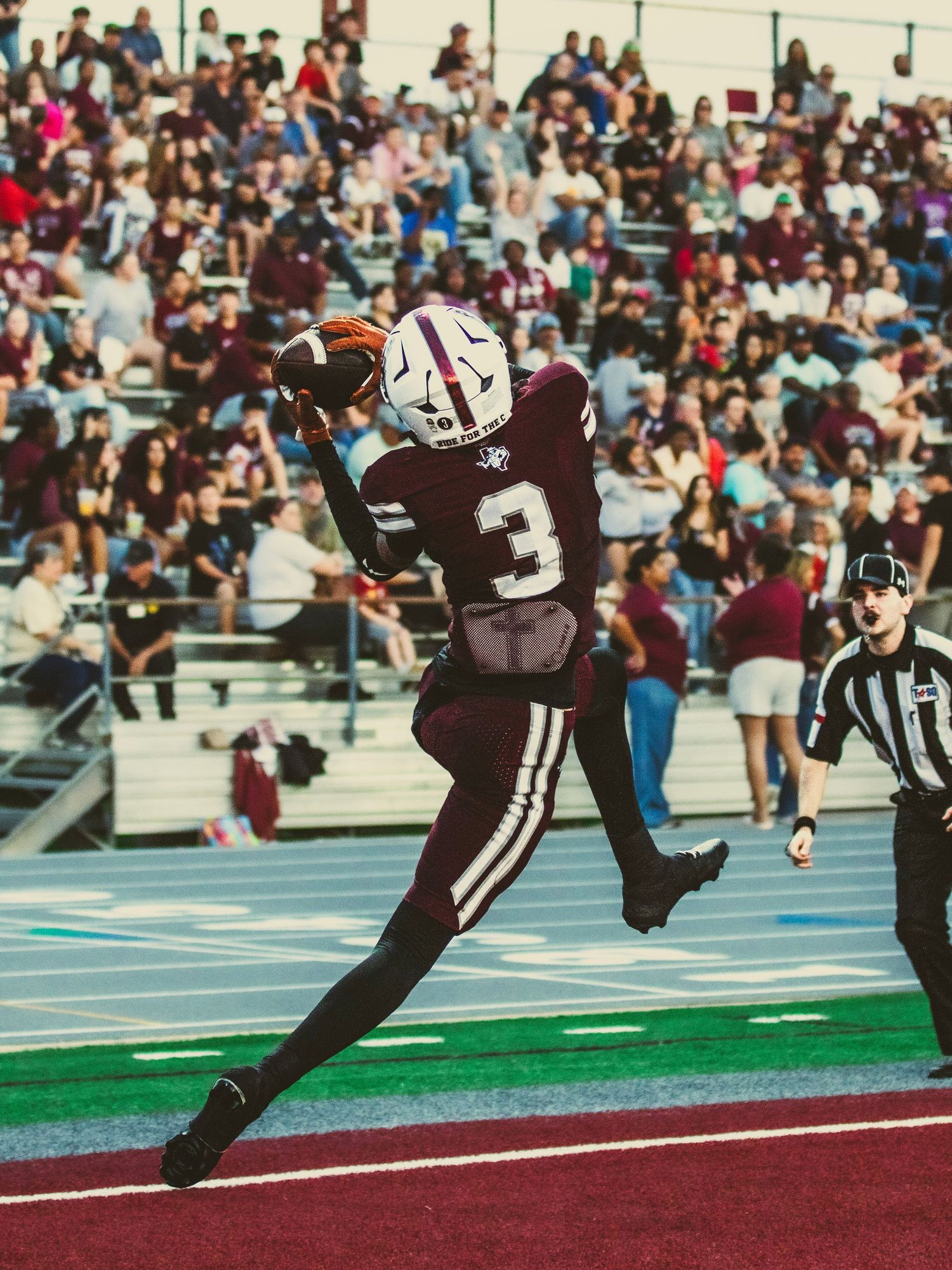 Sugar Land Space Cowboy's player catching a football for the touchdwon