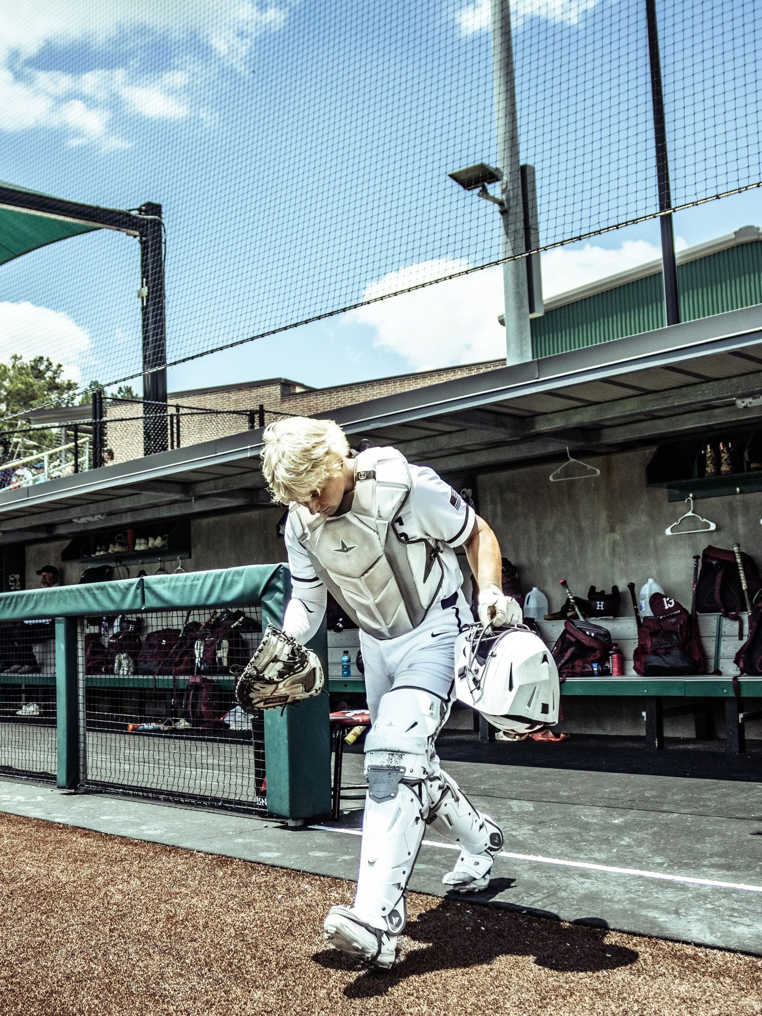 A photo made by shotz.by.jah of a baseball catcher   running out of a dugout