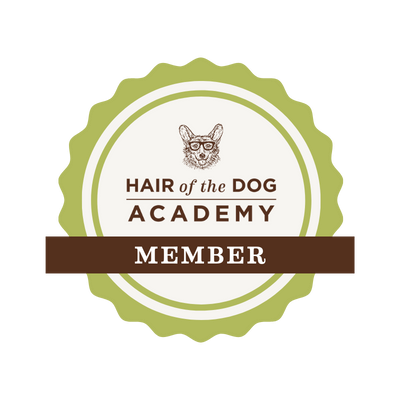 Circular green and brown membership badge for Hair of the Dog Academy with dog illustration.