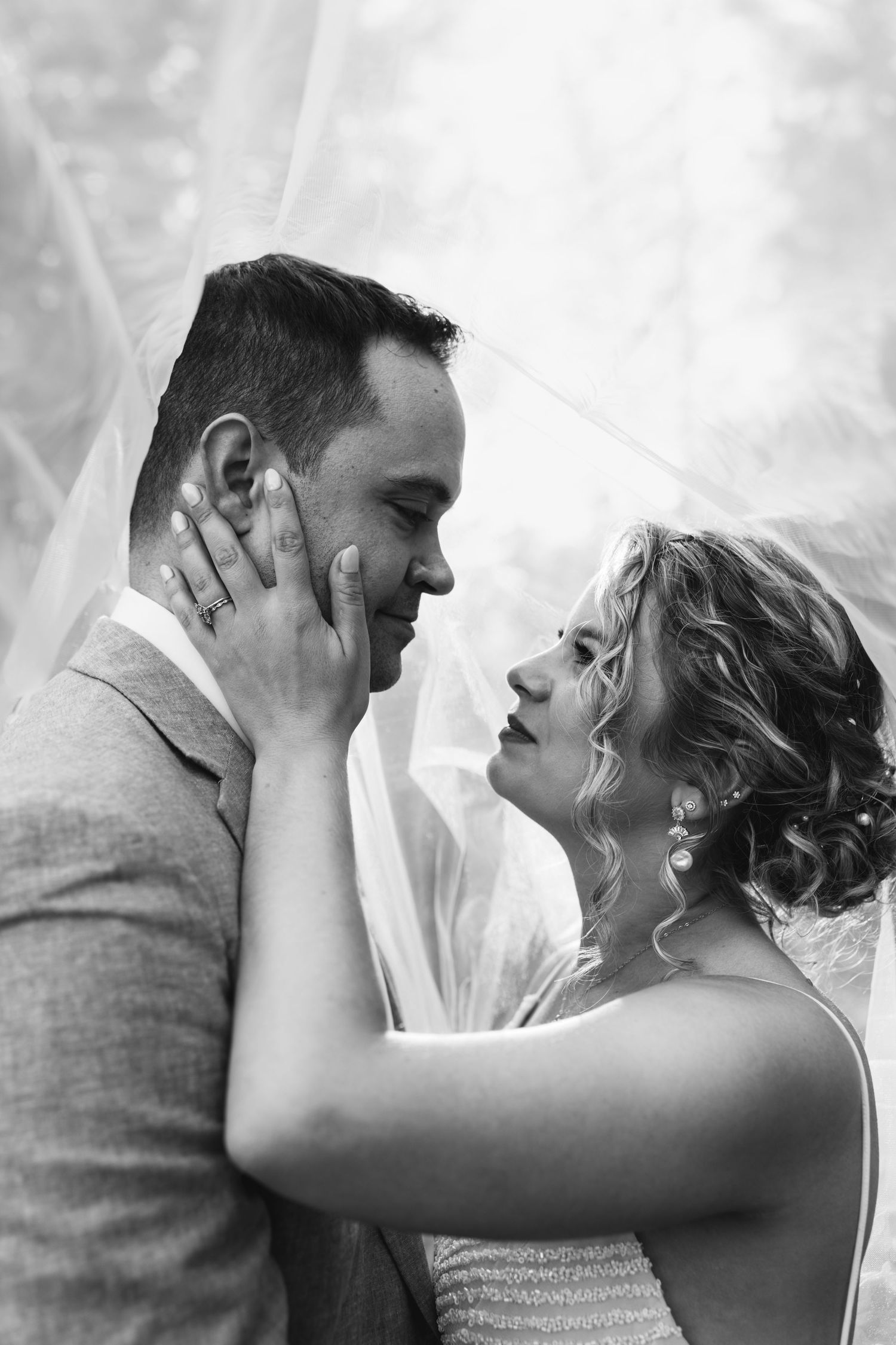 Timeless Wedding Photography with a Veil taken by Donahue Digital in Concord, New Hampshire.