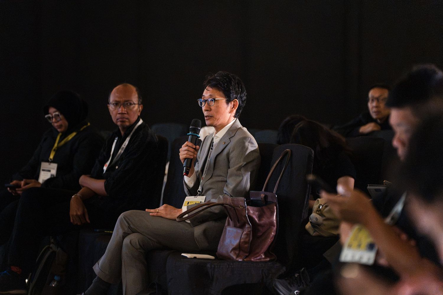 Forum guest asking questions during a Q&A session
