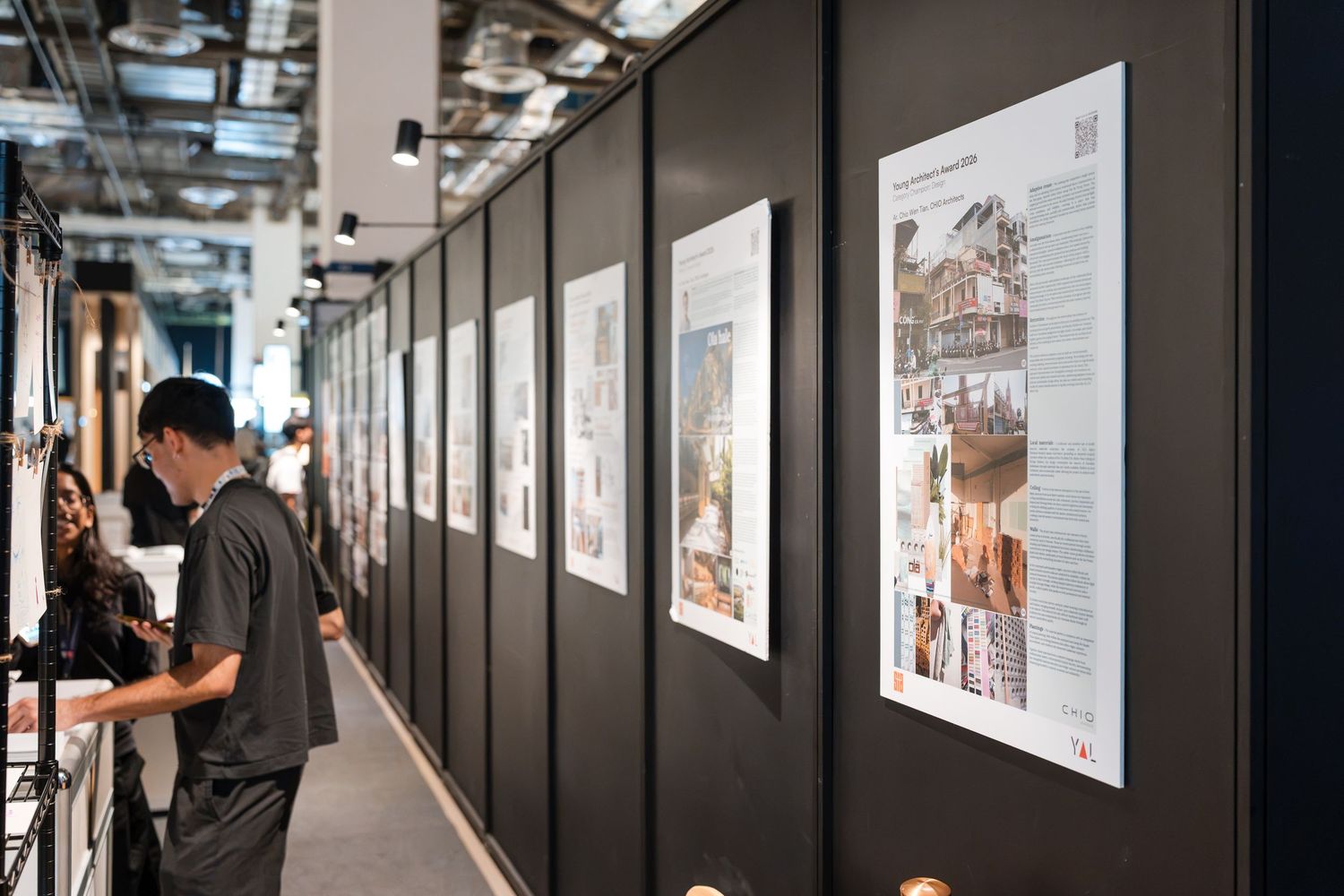 Side angle shot of a exhibition wall with photos and descriptions