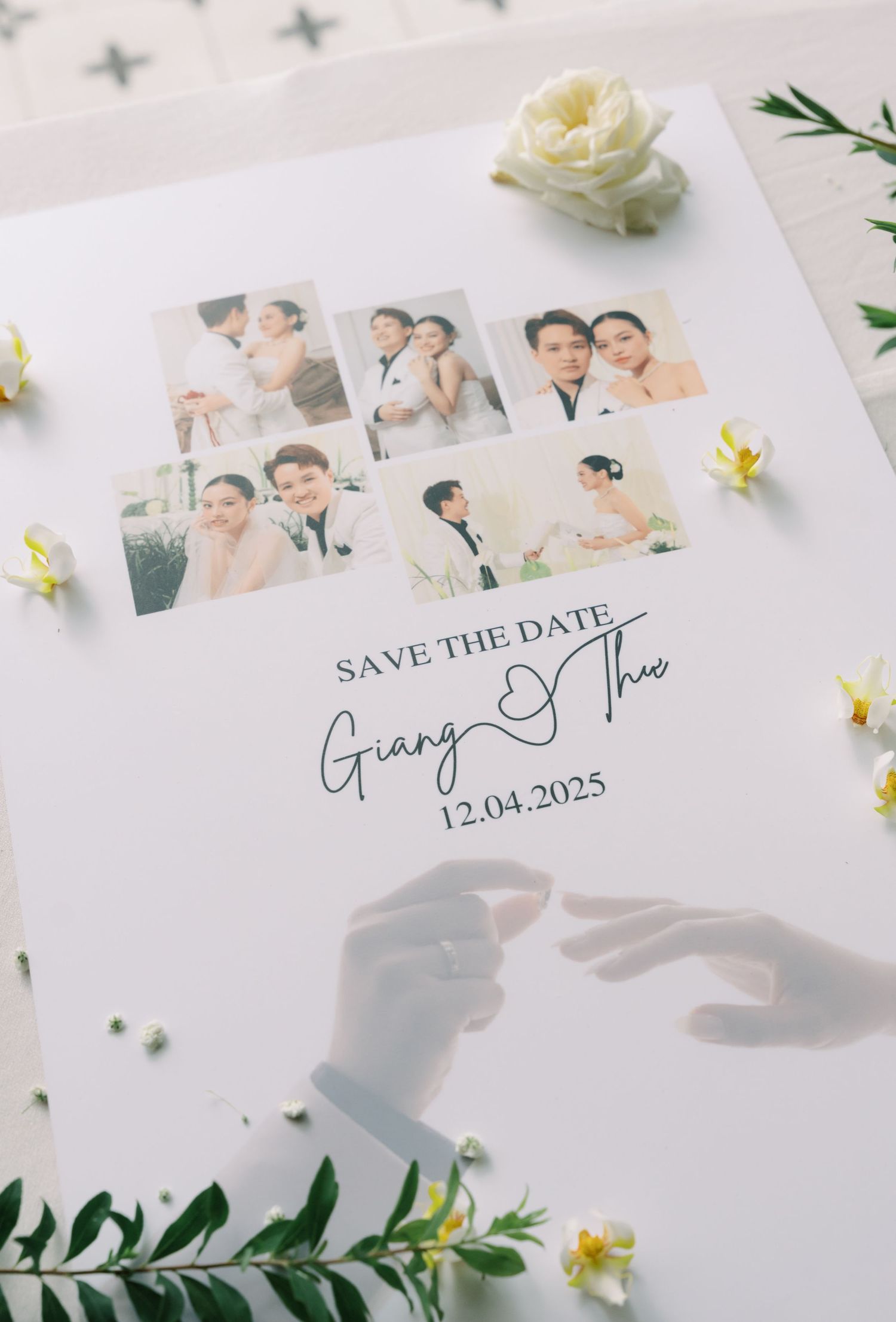 Elegant Save the Date card for Giang and Thie wedding on 12.04.2025 with photo collage and floral decor.