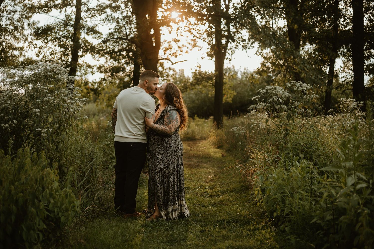 Man and woman in an embrace in a forest in Highland.