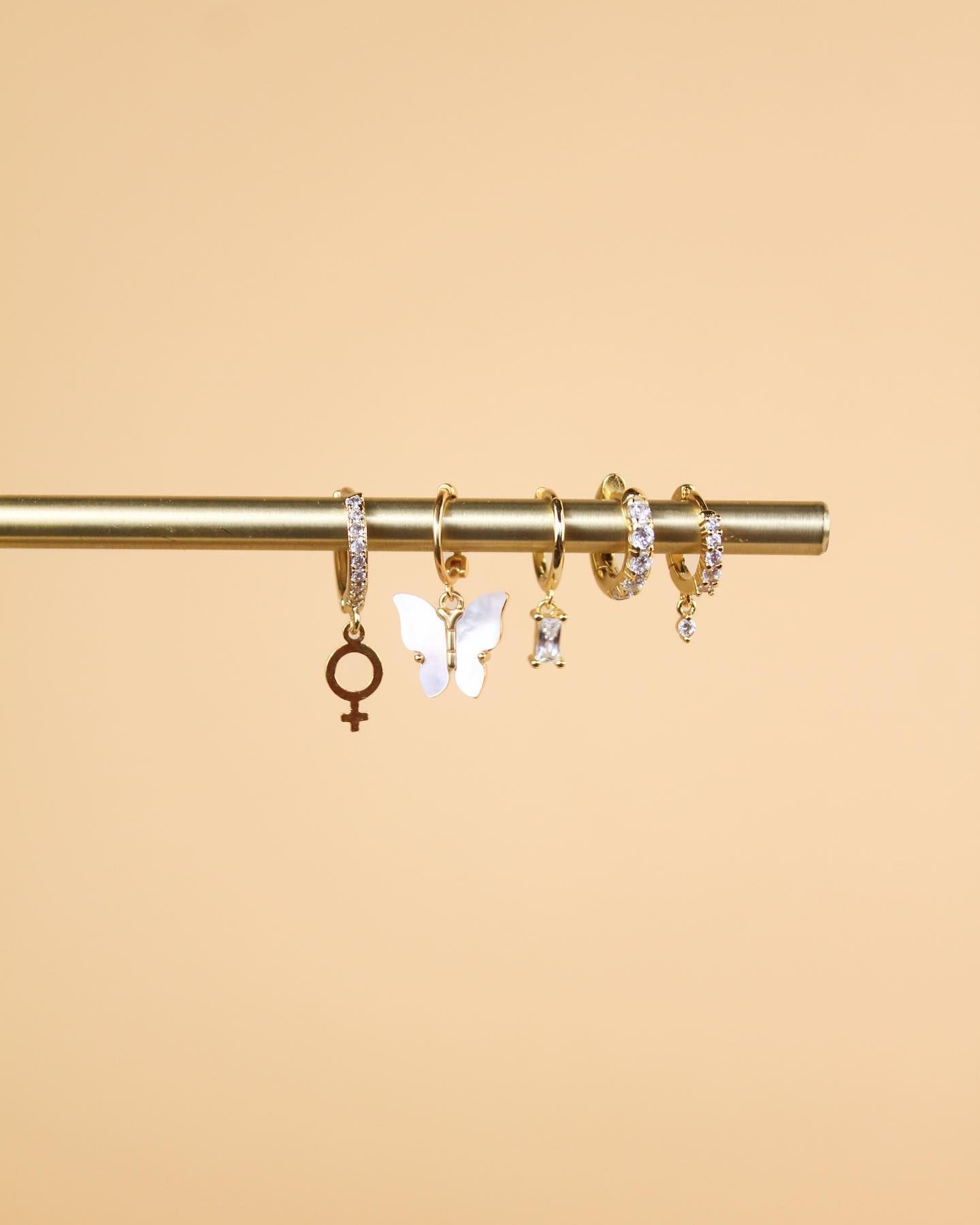 Five pairs of earrings.