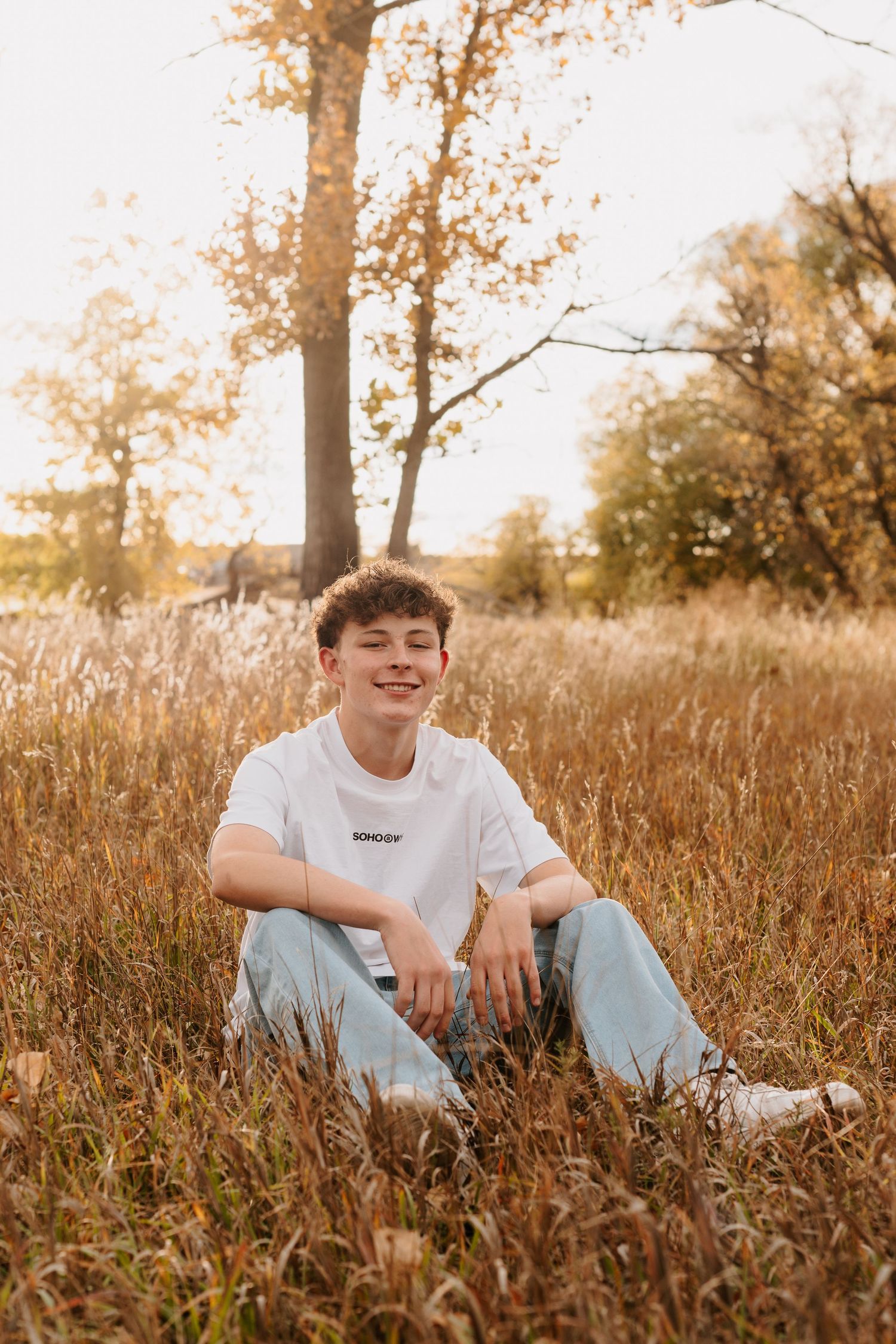 Confident senior guy stands tall against Colorado’s stunning backdrop, ready to take on the future with a bold, adventurous spirit.