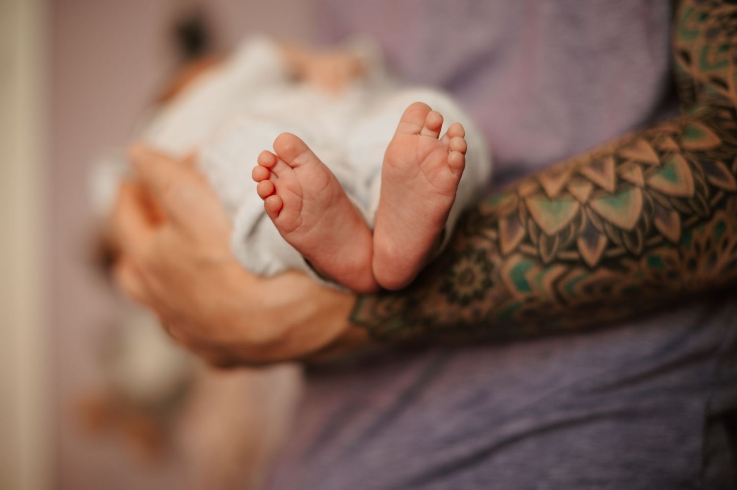 A cozy in-home newborn session in Denver, capturing the tender moments between parents and their precious little one. Soft, natural light
