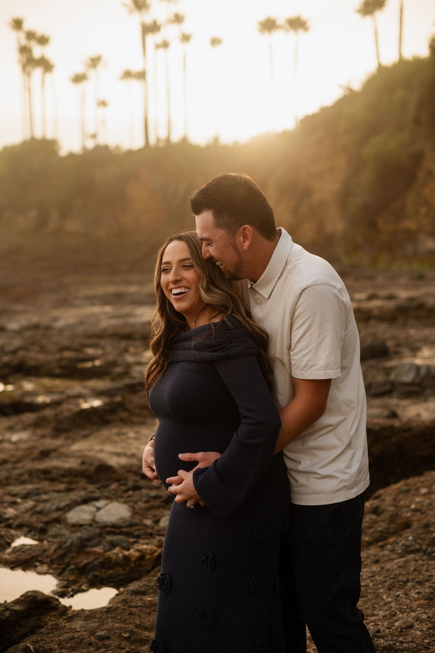 Romantic engagement photo of couple during golden hour at Newport Beach with an ocean background. maternity photos laguna beach