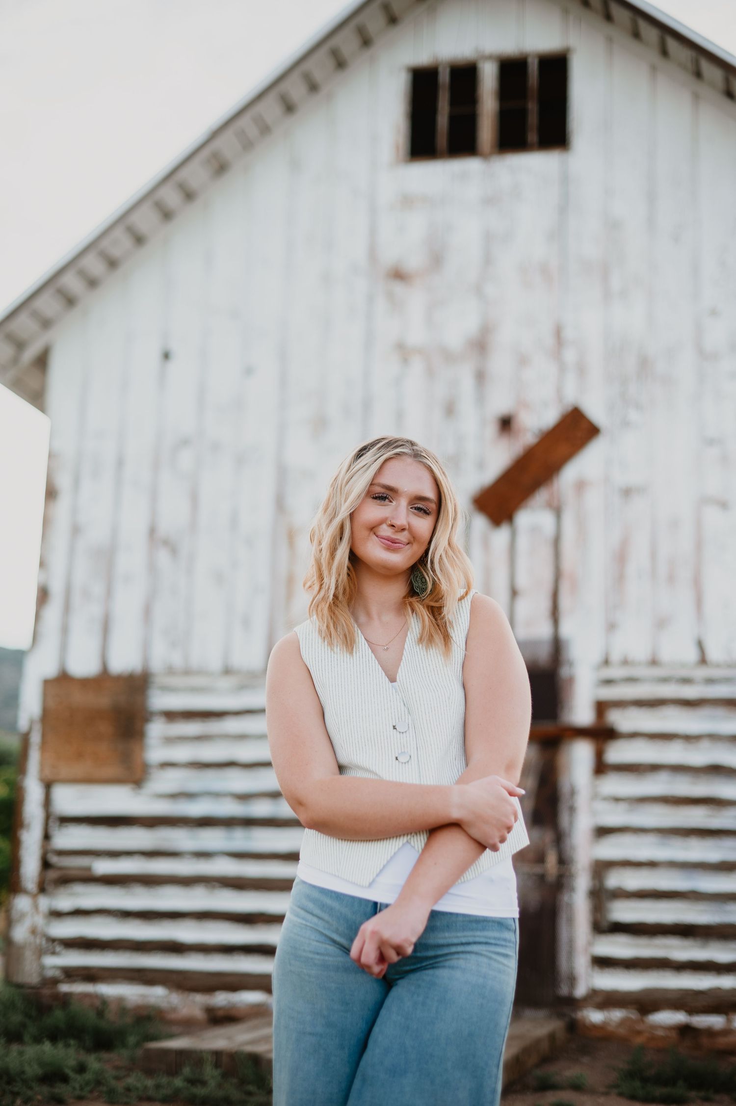 A senior girl shines in her cute outfit, with her blonde hair glowing against the scenic beauty of Littleton, Colorado—capturing her vibrant