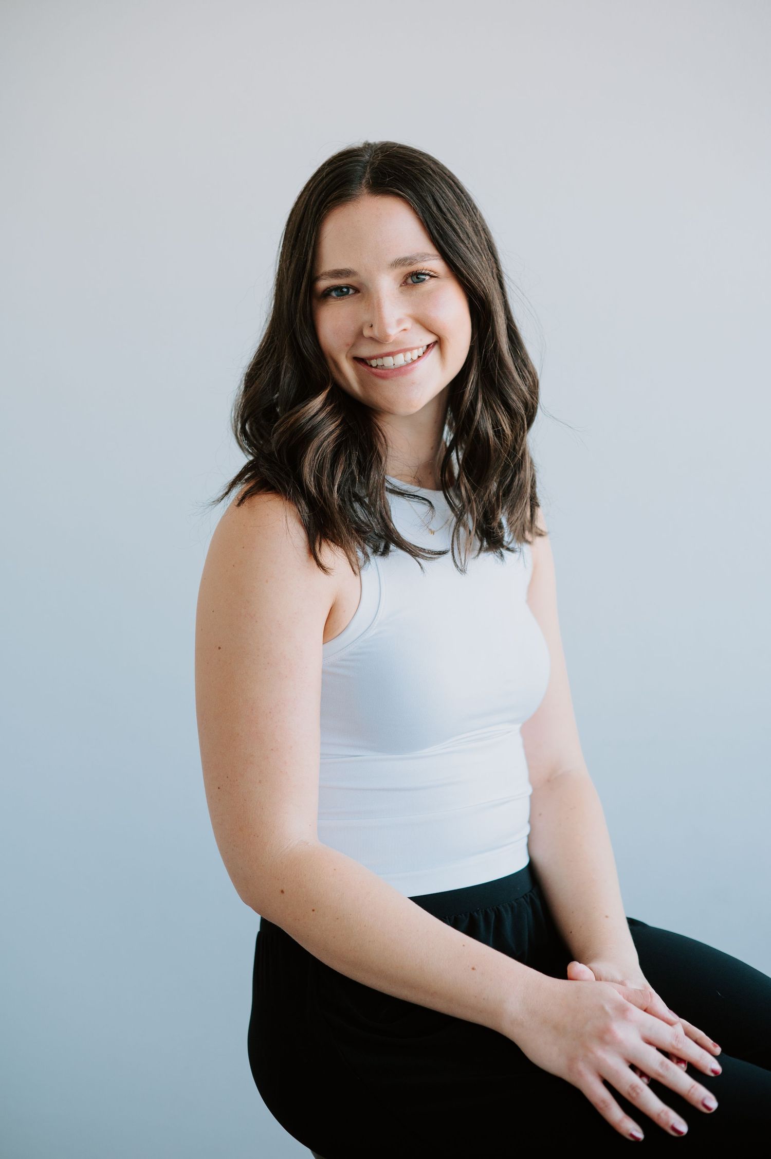 Professional headshot of a confident woman, showcasing her approachable yet powerful presence, perfect for elevating her business brand