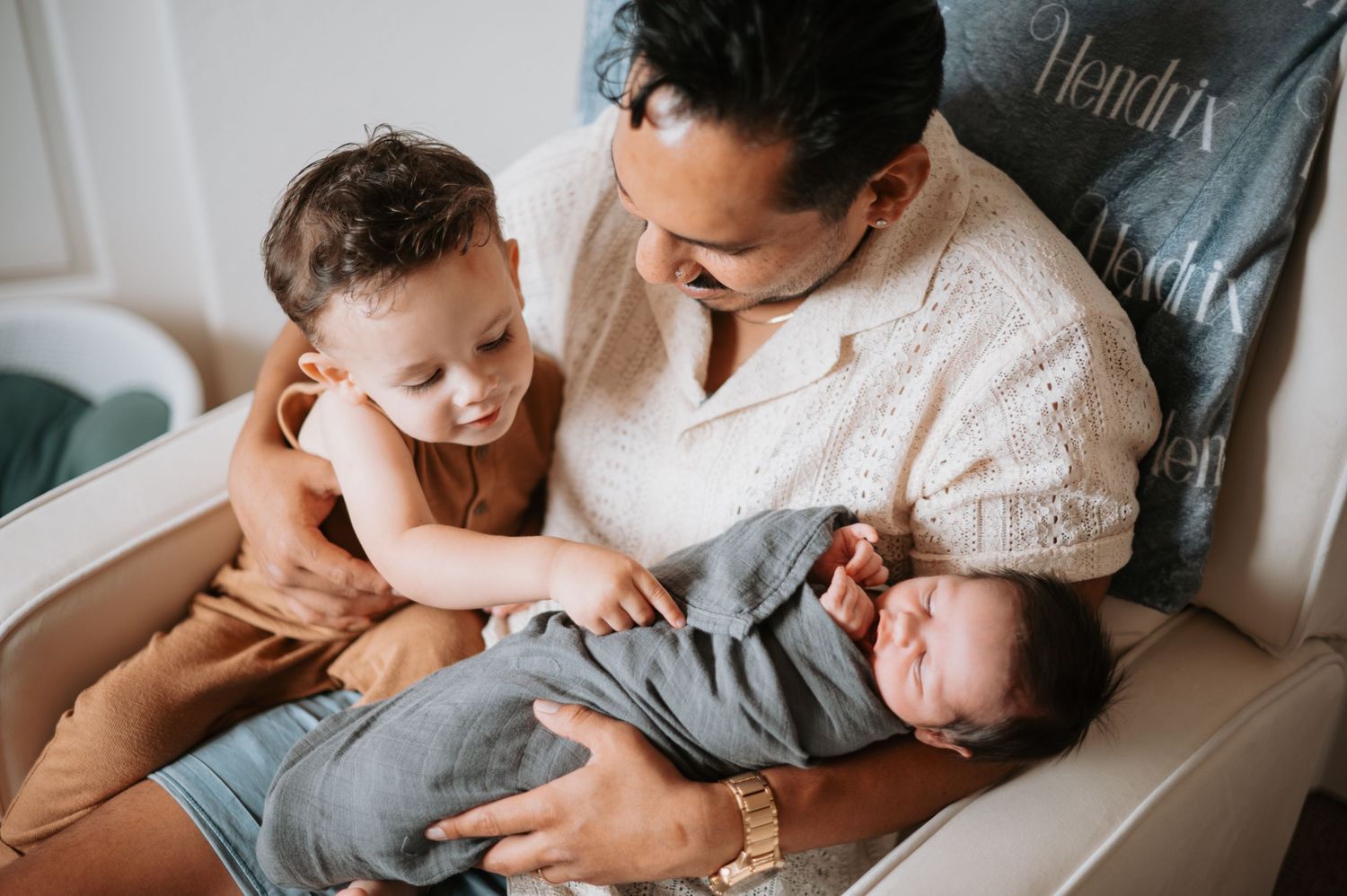 A cozy in-home newborn session in Denver, capturing the tender moments between parents and their precious little one. Soft, natural light