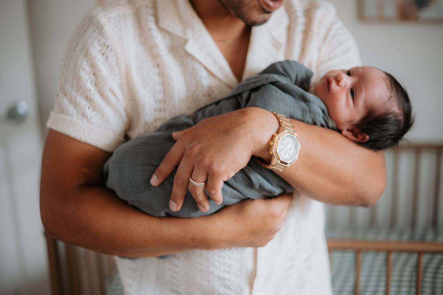 A cozy in-home newborn session in Denver, capturing the tender moments between parents and their precious little one. Soft, natural light