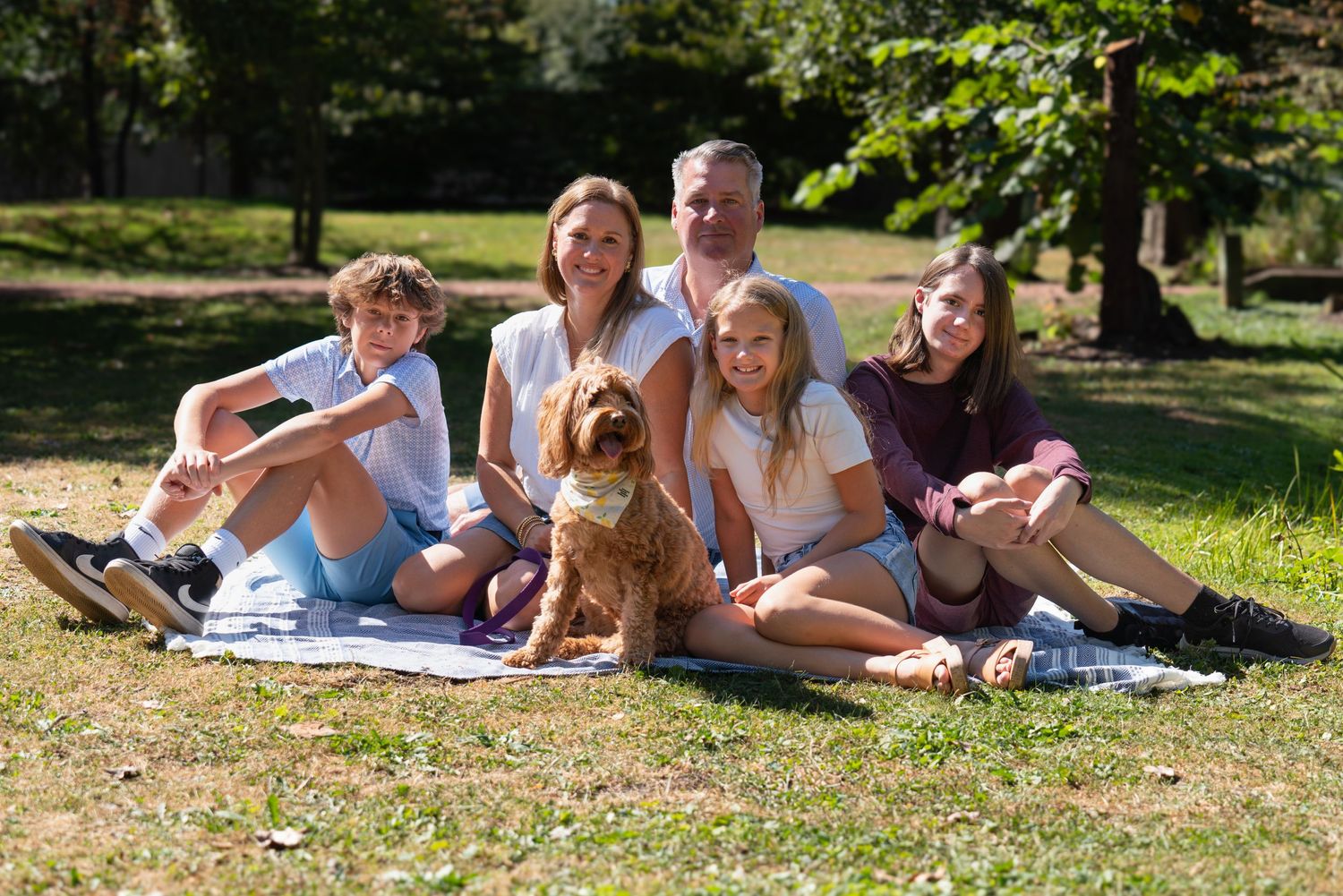 Family photography outdoors with pet