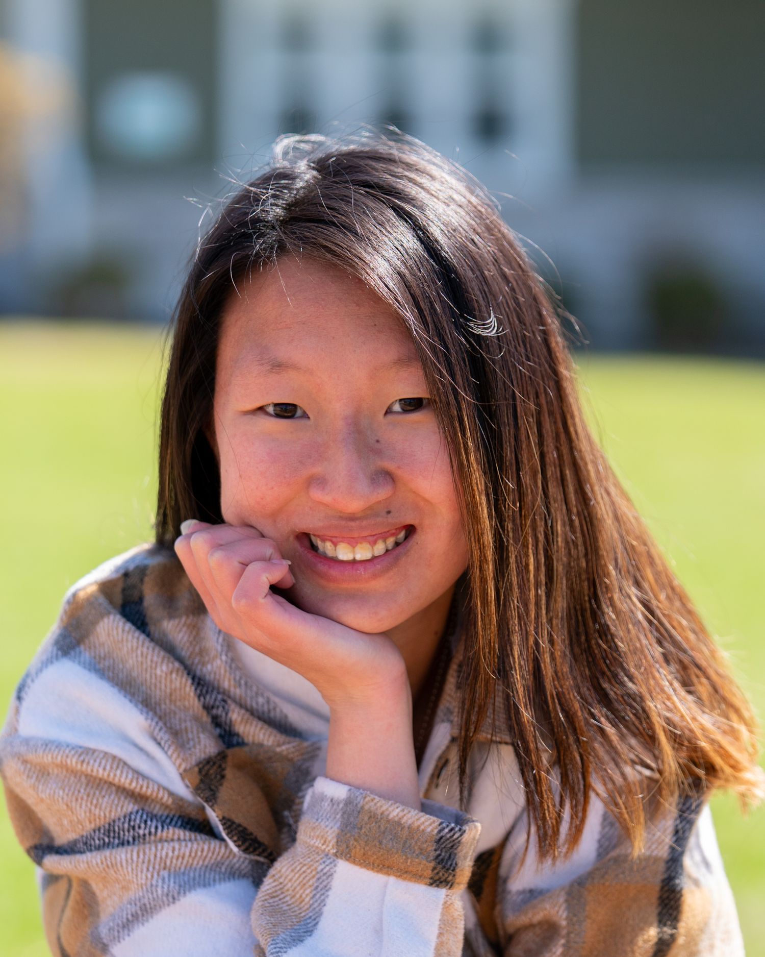 Outdoor headshot of a young woman