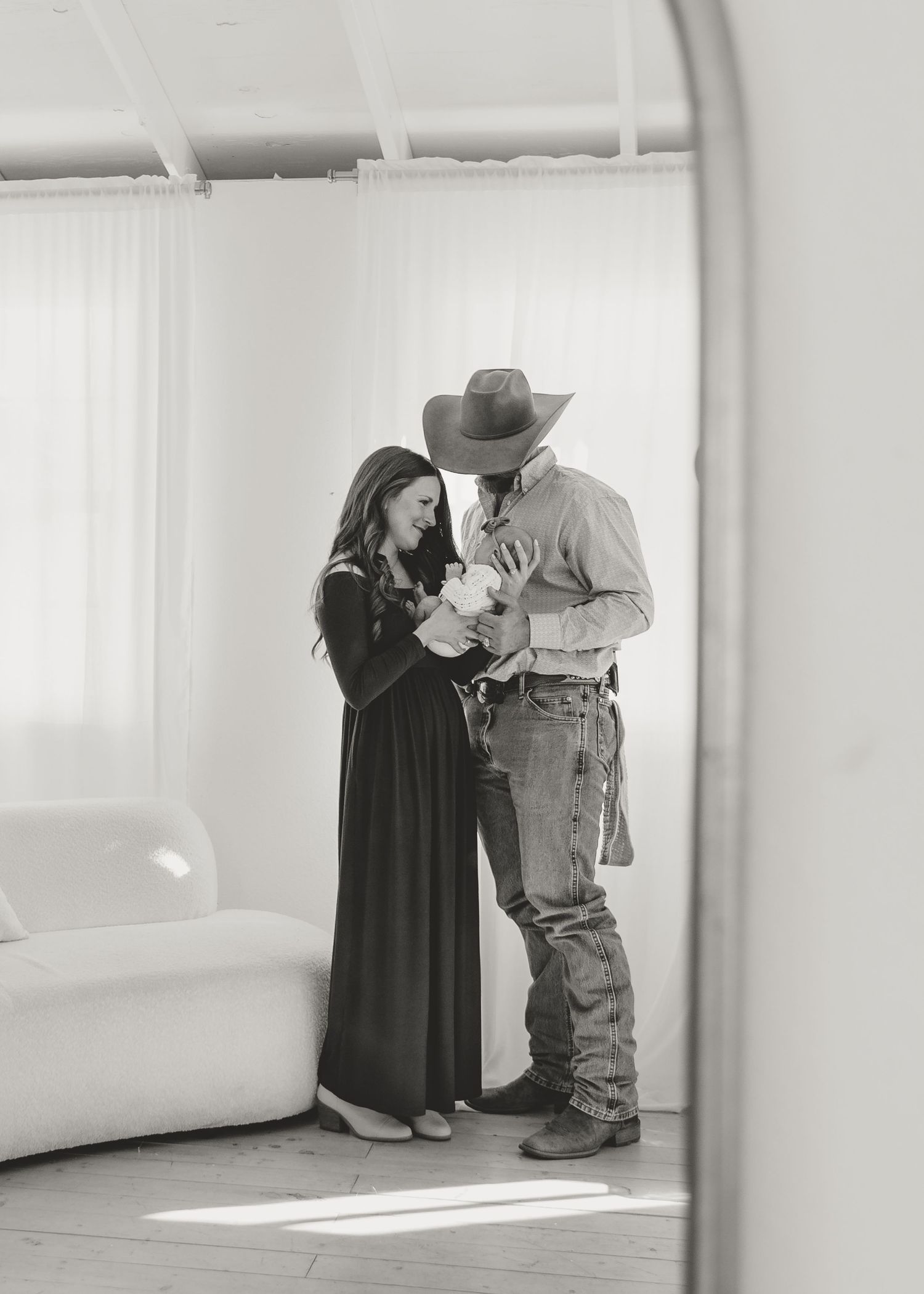 black and white mom dad and baby