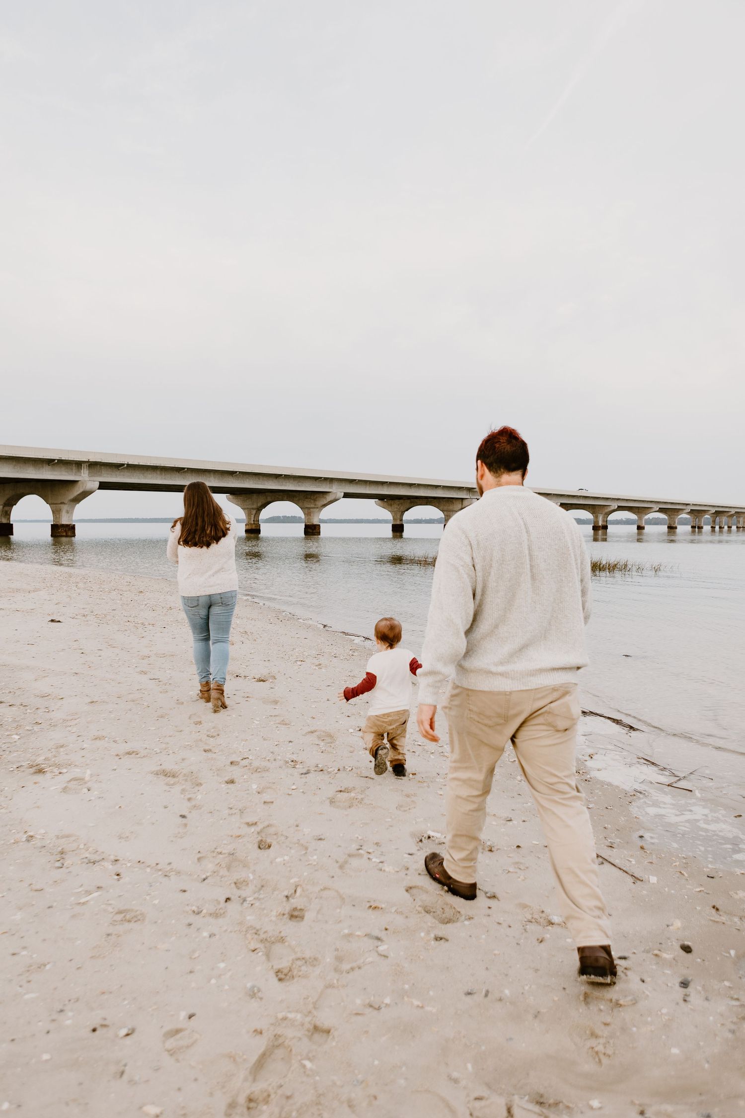 family walking by the water