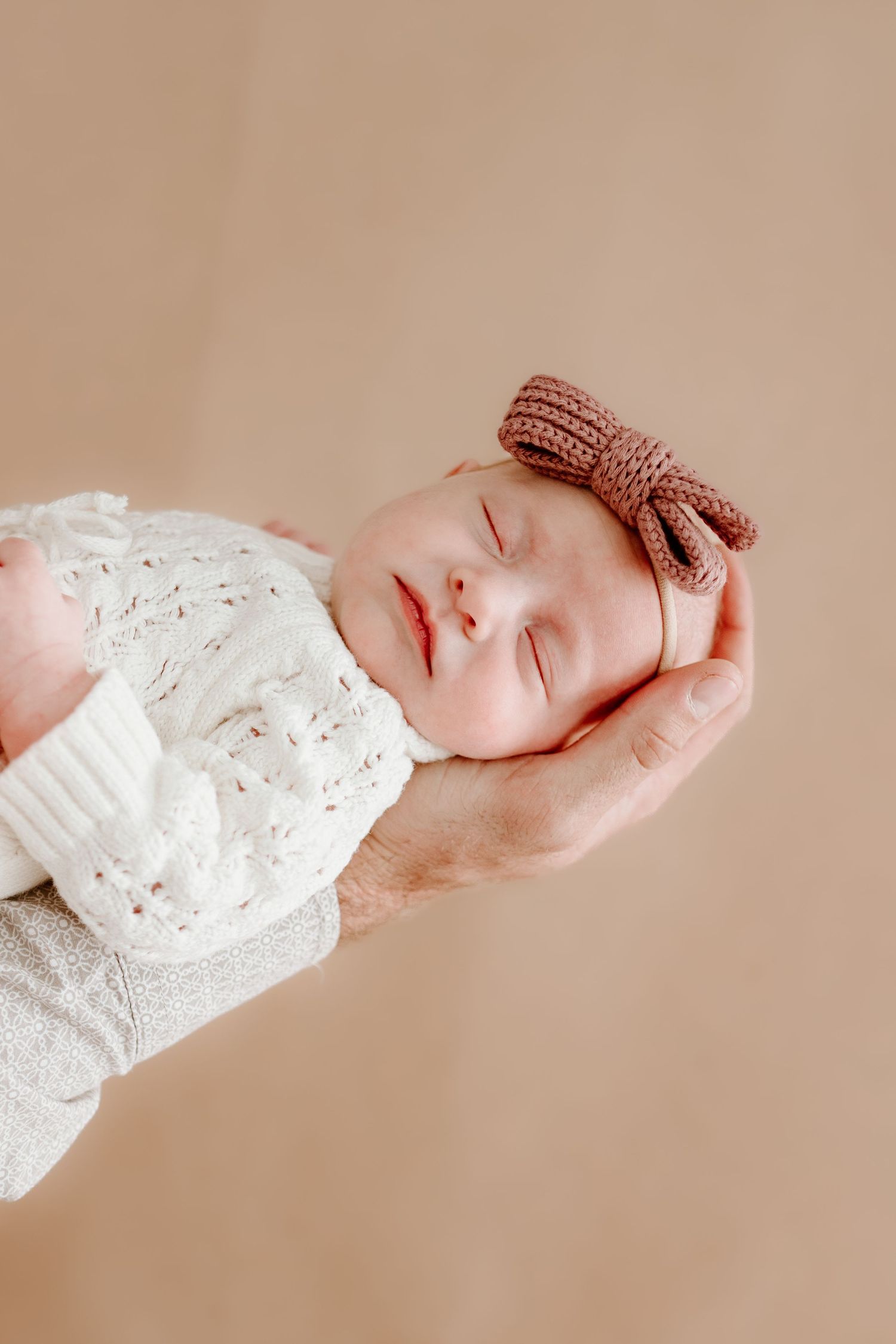 baby girl in dads hand